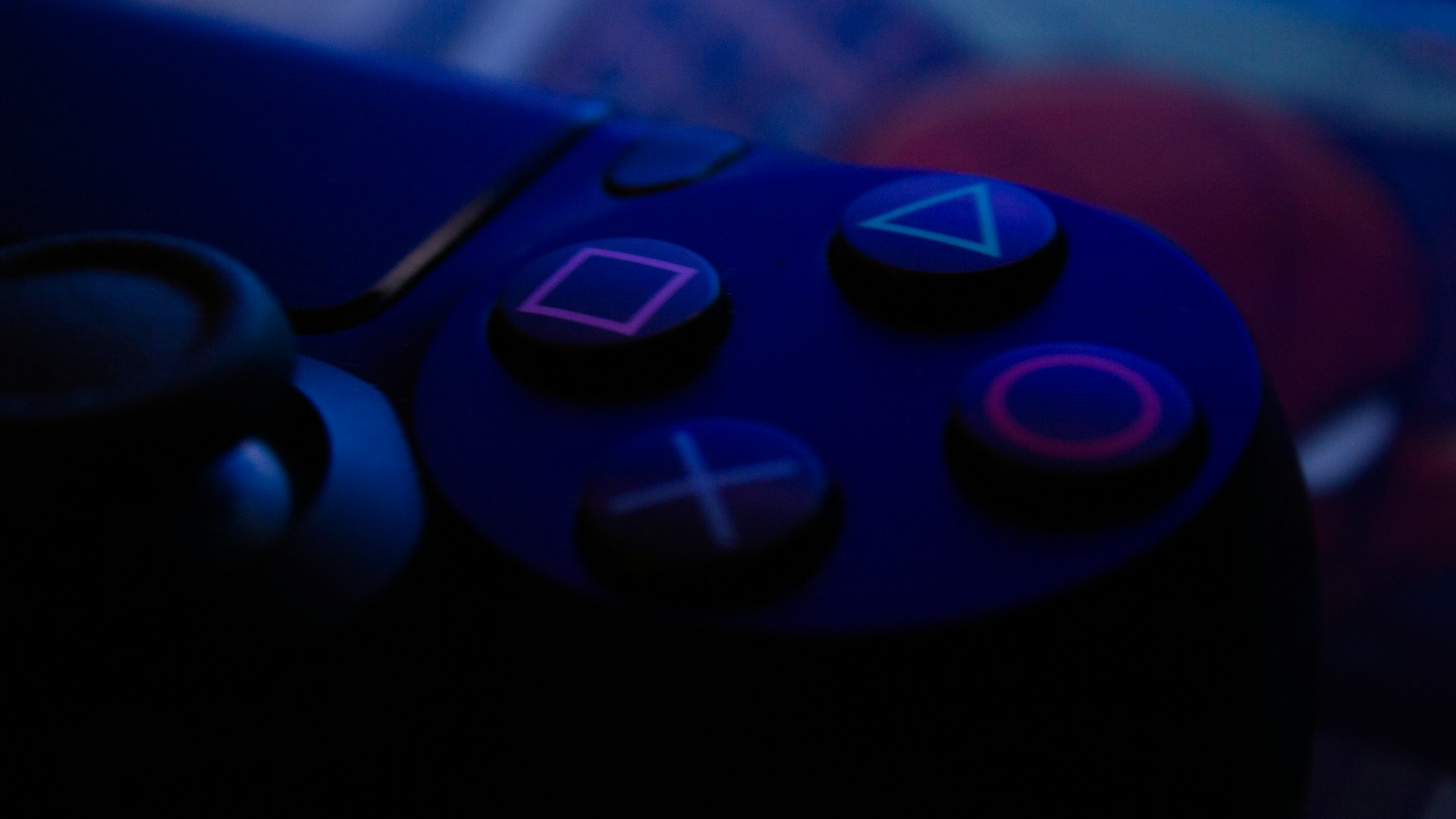 Neon-lit arcade cabinet glowing in the dark